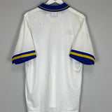 Back view of a vintage football shirt featuring blue and yellow stripes, perfect for collectors.